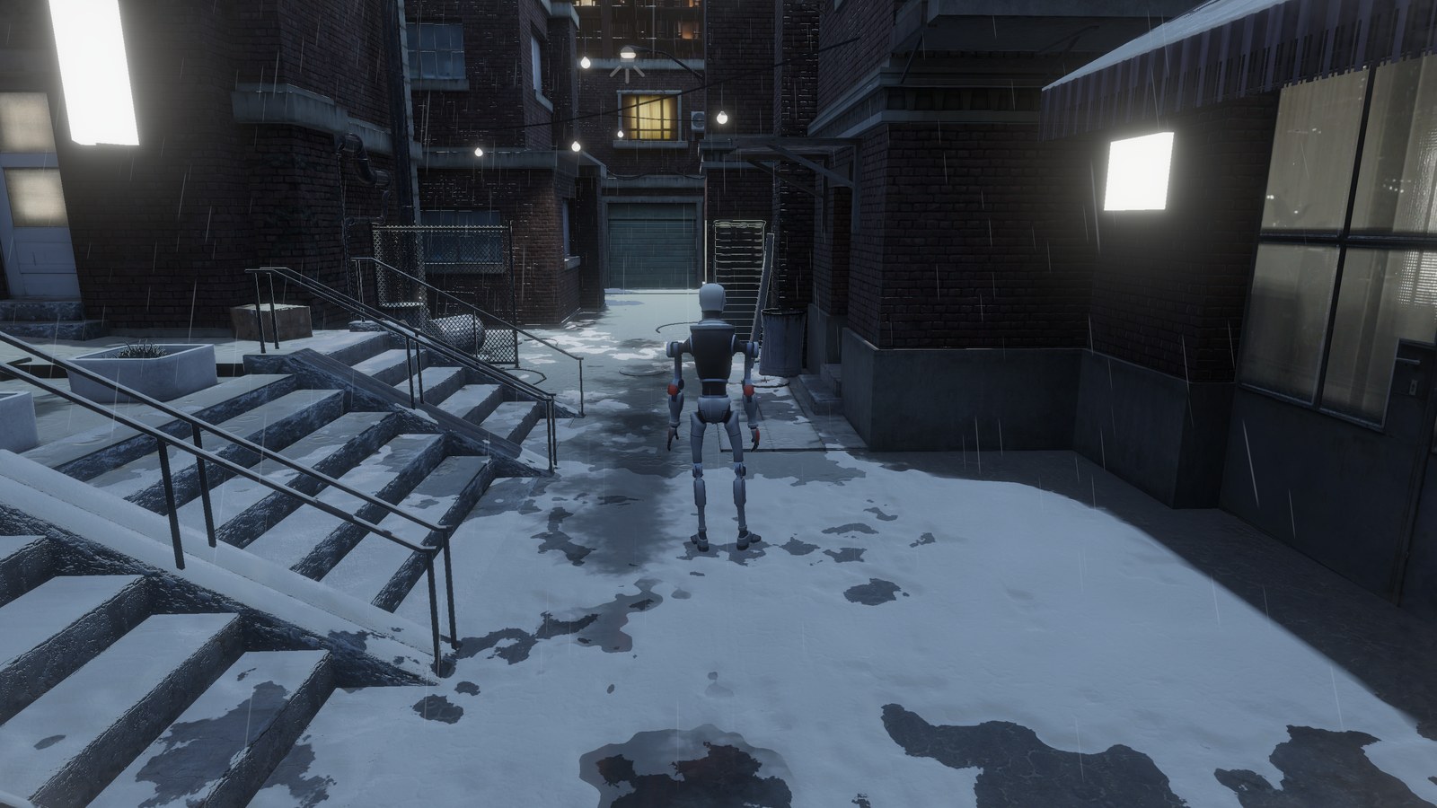 Snowy alley with dark puddles in the bare patches of snow