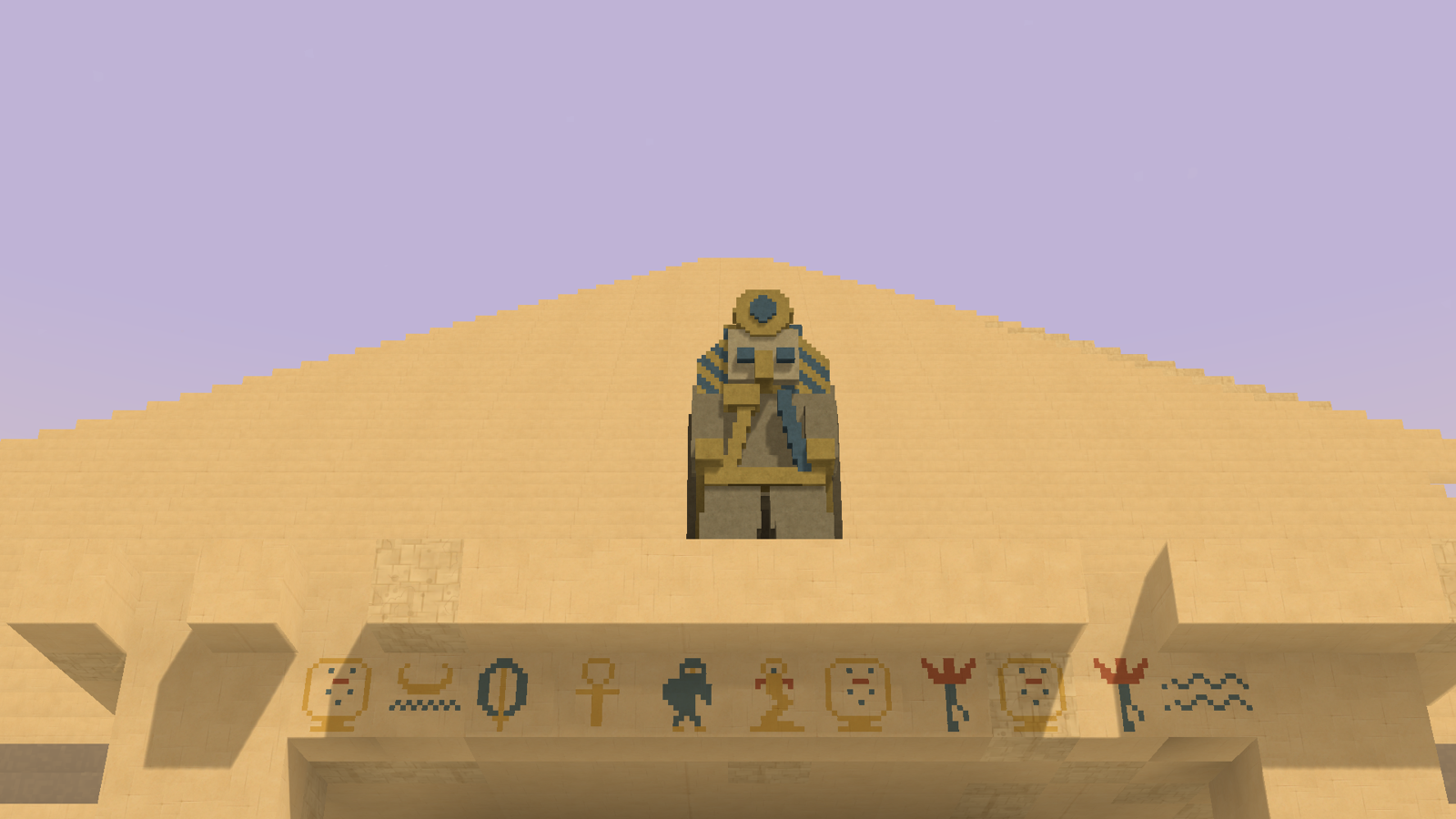 The guardian statue: a seated pharaoh on the portico roof